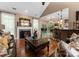 Open-concept living room boasts hardwood floors, a fireplace, and seamless flow to the kitchen and dining area at 171 Secretariat Dr, Mooresville, NC 28117