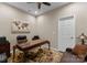 The office is equipped with a classic desk, a rolling leather chair, and ambient lighting for work at 171 Secretariat Dr, Mooresville, NC 28117