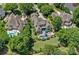 Aerial view of an estate home featuring a backyard swimming pool and mature landscaping at 18718 Peninsula Cove Ln, Cornelius, NC 28031