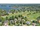 Aerial view of homes near a golf course and a waterfront community on Lake Norman at 18718 Peninsula Cove Ln, Cornelius, NC 28031