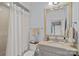 This bathroom features a shower and a large mirror over the vanity at 18718 Peninsula Cove Ln, Cornelius, NC 28031