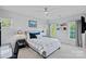This is a light-filled bedroom with a bed and small side tables at 18718 Peninsula Cove Ln, Cornelius, NC 28031