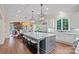 Gourmet kitchen featuring a marble island, custom cabinetry, and stainless steel appliances, perfect for cooking and entertaining at 18718 Peninsula Cove Ln, Cornelius, NC 28031