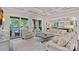 Spacious living room with coffered ceilings and sliding doors opening to a patio and pool at 18718 Peninsula Cove Ln, Cornelius, NC 28031