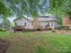 Backyard featuring a deck, with a spacious lawn at 2223 Jon Chris Dr, Harrisburg, NC 28075