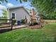 Backyard featuring a wood deck and fenced yard at 2223 Jon Chris Dr, Harrisburg, NC 28075