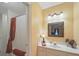 A bathroom featuring vanity, framed mirror, and shower with curtain in an area with soft lighting at 2223 Jon Chris Dr, Harrisburg, NC 28075
