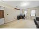 A well-lit bedroom featuring neutral carpet, a desk area, and classic decor at 2223 Jon Chris Dr, Harrisburg, NC 28075