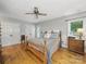 Bedroom boasting of wood floors, ceiling fan, and double closets at 2223 Jon Chris Dr, Harrisburg, NC 28075