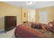 Comfortable bedroom offers a glimpse into the en-suite bath, closets, dresser, and soft carpet at 2223 Jon Chris Dr, Harrisburg, NC 28075