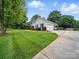 Charming home with lush lawn and mature trees at 2223 Jon Chris Dr, Harrisburg, NC 28075