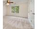 Empty bedroom with neutral carpet, closet, and large window at 2504 Korbel Ct, Waxhaw, NC 28173