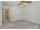 Inviting bedroom features plush carpeting and ample closet space for optimal comfort and convenience at 2504 Korbel Ct, Waxhaw, NC 28173