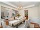 Bright dining room showcasing hardwood floors, a stylish light fixture, and elegant decor for entertaining guests at 2504 Korbel Ct, Waxhaw, NC 28173