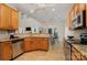 Open kitchen area with stainless steel appliances, granite countertops, and a breakfast bar for casual dining at 2504 Korbel Ct, Waxhaw, NC 28173
