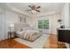 Relaxing main bedroom with neutral tones, tray ceiling, and natural light from the large window at 2504 Korbel Ct, Waxhaw, NC 28173
