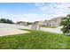 Landscaped back yard with wooden shed and white fence at 2515 Walnut Forest Dr, Charlotte, NC 28216