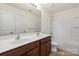 Bathroom featuring double sink vanity, and bathtub with shower at 2515 Walnut Forest Dr, Charlotte, NC 28216
