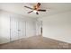 Bedroom with a double door closet, neutral walls and flooring at 2515 Walnut Forest Dr, Charlotte, NC 28216