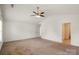 Spacious bedroom features neutral walls, carpet flooring, and two doorways to other rooms at 2515 Walnut Forest Dr, Charlotte, NC 28216