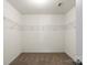 Walk-in closet with carpet flooring and wire shelving at 2515 Walnut Forest Dr, Charlotte, NC 28216
