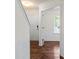Welcoming entryway with hardwood floors, wainscoting, and a view into a bright, adjacent room at 2515 Walnut Forest Dr, Charlotte, NC 28216