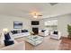 Bright and spacious living room with a fireplace, hardwood floors, a ceiling fan, and an abundance of natural light at 2515 Walnut Forest Dr, Charlotte, NC 28216