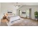 Large primary bedroom features vaulted ceiling, ceiling fan and stylish decor at 2515 Walnut Forest Dr, Charlotte, NC 28216