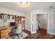 Inviting home office with built-in shelves, natural light, neutral colors, hardwood floors, and adjacent french doors at 2515 Walnut Forest Dr, Charlotte, NC 28216