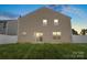 Two-story home with windows overlooking a spacious, green backyard at 2515 Walnut Forest Dr, Charlotte, NC 28216