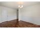 Versatile space with hardwood floors, wainscoting, and ample natural light at 2515 Walnut Forest Dr, Charlotte, NC 28216