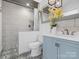 Modern bathroom featuring updated fixtures, tiled shower, and stylish vanity with ample counter space at 2633 N Sharon Amity Rd, Charlotte, NC 28205