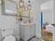 Stylish bathroom with modern vanity, decorative mirror, and patterned floor tiles at 2633 N Sharon Amity Rd, Charlotte, NC 28205