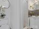 Modern bathroom with white tile shower, black subway tile, and stylish vanity with a round mirror at 2633 N Sharon Amity Rd, Charlotte, NC 28205