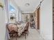Inviting breakfast nook featuring a brick wall, a rustic sideboard, and sliding barn door detail at 2633 N Sharon Amity Rd, Charlotte, NC 28205