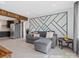 Open-concept living space with tile flooring, modern accent wall, and seamless flow to the kitchen at 2633 N Sharon Amity Rd, Charlotte, NC 28205