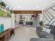 Spacious open-concept living area with an updated kitchen and comfortable seating, perfect for entertaining at 2633 N Sharon Amity Rd, Charlotte, NC 28205