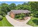 Aerial view of a brick home with a long driveway and mature trees at 2715 Kennetuck Ct, Charlotte, NC 28273