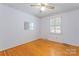 Bedroom with hardwood floors, a window with shutters, and a ceiling fan at 2715 Kennetuck Ct, Charlotte, NC 28273
