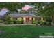 Charming brick home with manicured lawn and mature landscaping at 2715 Kennetuck Ct, Charlotte, NC 28273