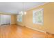 Bright living room with hardwood floors, white trim, and ample natural light from shuttered windows at 2715 Kennetuck Ct, Charlotte, NC 28273