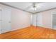 Bedroom with hardwood floors with a closet and bathroom entrance visible at 2715 Kennetuck Ct, Charlotte, NC 28273