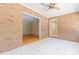 Sunroom with brick walls, tile flooring, and access to adjacent rooms at 2715 Kennetuck Ct, Charlotte, NC 28273