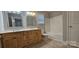 This bathroom features double sinks, a vanity and a shower-tub combo at 2820 Bellhaven Cir, Charlotte, NC 28214