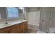 This bathroom features double sinks, a vanity and a shower-tub combo at 2820 Bellhaven Cir, Charlotte, NC 28214