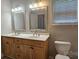 This bathroom has double sinks, a vanity and a bright window with light streaming through at 2820 Bellhaven Cir, Charlotte, NC 28214