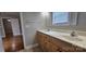 This bathroom has double sinks, a vanity, a toilet and a doorway leading to another room at 2820 Bellhaven Cir, Charlotte, NC 28214