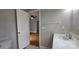 This bathroom has a toilet, a sink, and a doorway leading to another room at 2820 Bellhaven Cir, Charlotte, NC 28214
