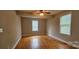 This bedroom features hardwood floors and two windows that allow natural light to fill the room at 2820 Bellhaven Cir, Charlotte, NC 28214