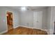 Bedroom with hardwood flooring and a view of the eat-in kitchen at 2820 Bellhaven Cir, Charlotte, NC 28214